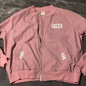A light purple/pink windbreaker jacket